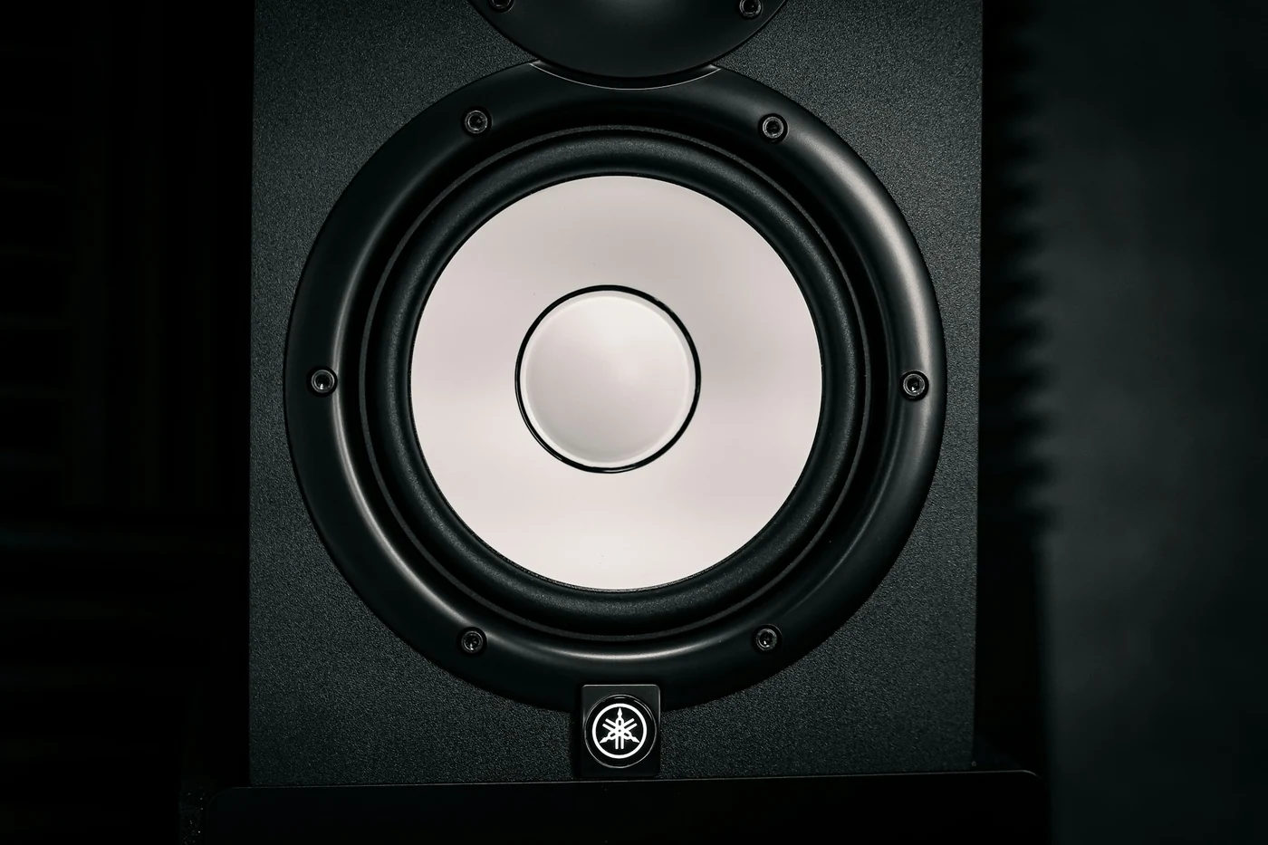 Close view of Yamaha HS5 speakers in a home studio